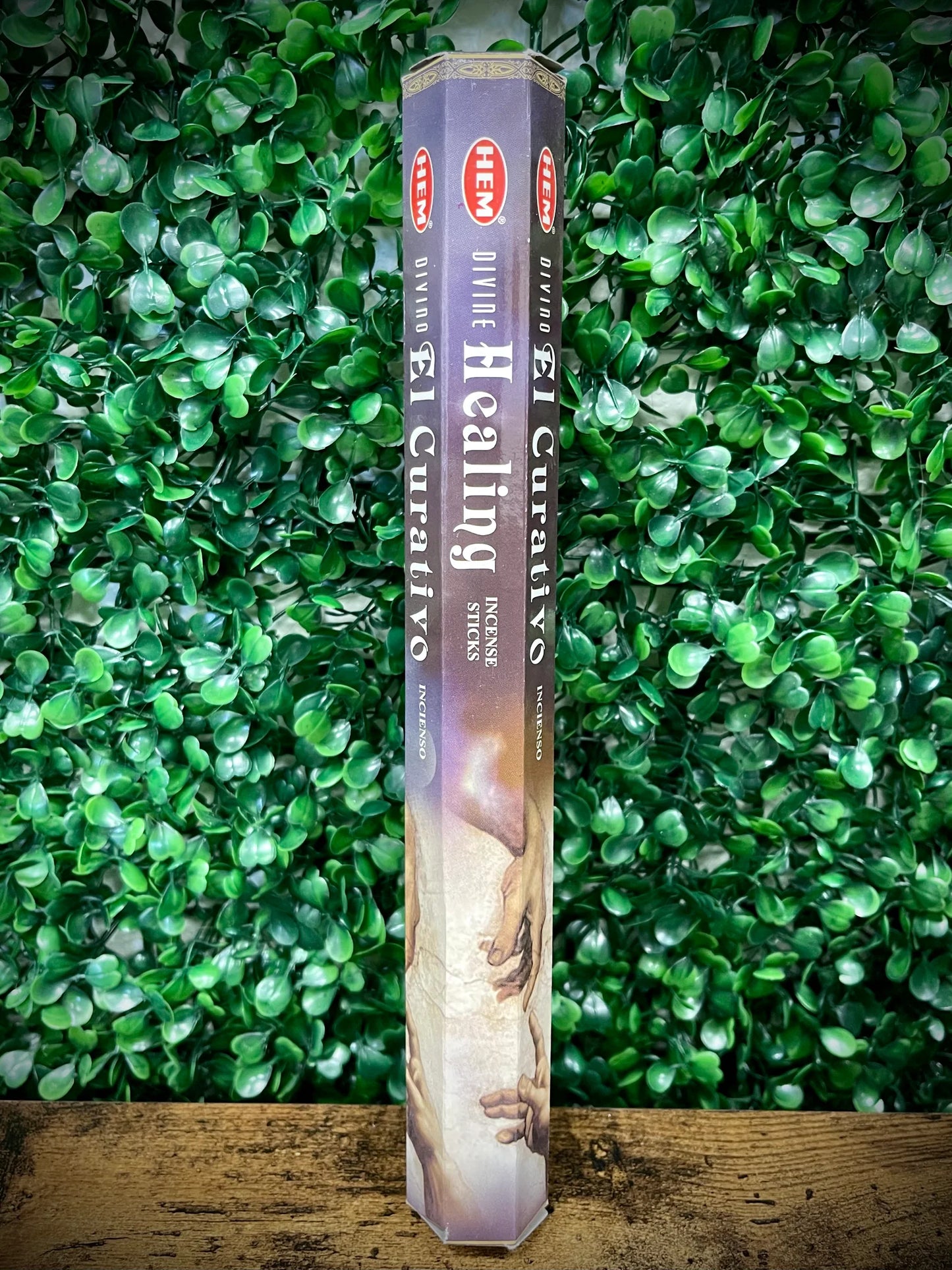 Heavenly Blue Healing incense stick on a green leafy background