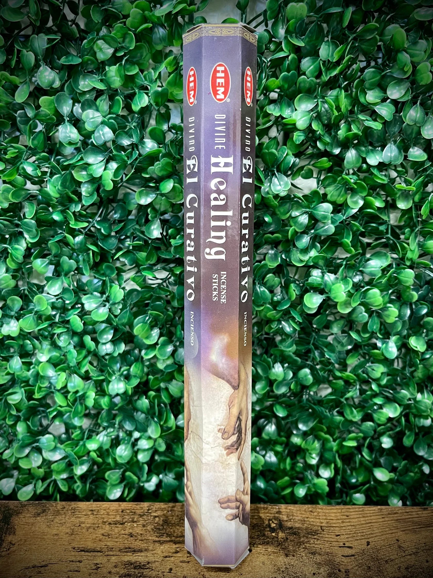 Heavenly Blue Healing incense stick on a green leafy background