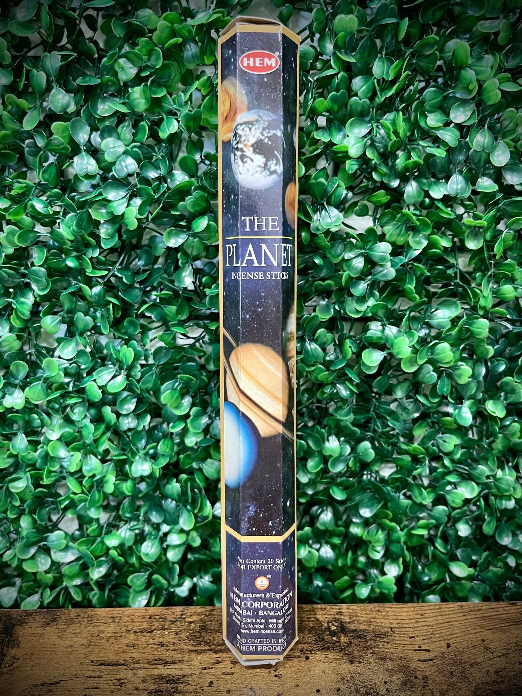 Hem incense stick packaging with 'The Planet' design on a green leafy background
