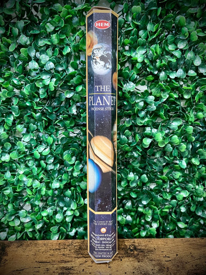 Hem incense stick packaging with 'The Planet' design on a green leafy background