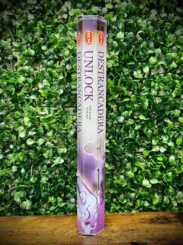 Pack of Incense sticks with Unlocking  against a green leafy background